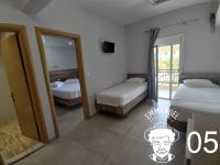 Postel nebo postele na pokoji v ubytování Emmanuel Apartments