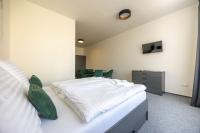 Postel nebo postele na pokoji v ubytování Hotel THT