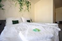 Postel nebo postele na pokoji v ubytování Hotel THT