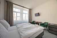 Postel nebo postele na pokoji v ubytování Hotel THT