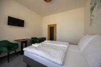 Postel nebo postele na pokoji v ubytování Hotel THT