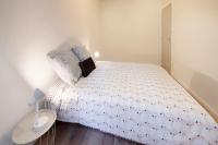 Łóżko lub łóżka w pokoju w obiekcie LD-Location Hôtel