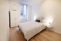 Łóżko lub łóżka w pokoju w obiekcie LD-Location Hôtel