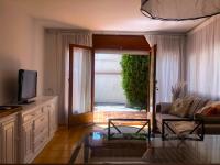 TV a/nebo společenská místnost v ubytování Apartamento con Jardín Platja d'Aro