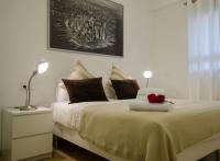 Posteľ alebo postele v izbe v ubytovaní Apartamentos Turísticos Duque de Hornachuelos