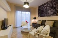 Televízia a/alebo spoločenská miestnosť v ubytovaní Apartamentos Turísticos Duque de Hornachuelos