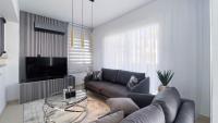 TV a/nebo společenská místnost v ubytování Villa Günther Palm Village