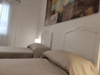 A bed or beds in a room at Villa Punta Piccola sul mare
