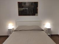 A bed or beds in a room at Villa Punta Piccola sul mare