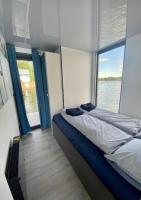 Posteľ alebo postele v izbe v ubytovaní AquaHouse Zamkowe