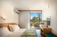 Postel nebo postele na pokoji v ubytování San Marino Resort