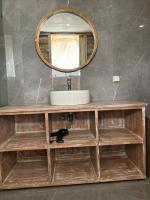 a bathroom vanity with a sink and a mirror at The volcano in Kubupenlokan