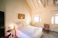 Postel nebo postele na pokoji v ubytování Casa Palacio Doña Guiomar