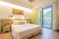 Posteľ alebo postele v izbe v ubytovaní Saronis Hotel Agistri - Adults Only