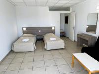 Postel nebo postele na pokoji v ubytování Green Bungalows Hotel Apartments
