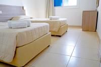 Postel nebo postele na pokoji v ubytování Green Bungalows Hotel Apartments