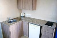 Kuchyň nebo kuchyňský kout v ubytování Green Bungalows Hotel Apartments