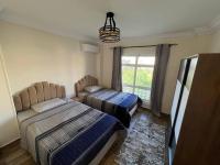 Postel nebo postele na pokoji v ubytování Royal Madinaty 2BR Residence
