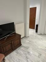 Televízia a/alebo spoločenská miestnosť v ubytovaní Palace Apartment
