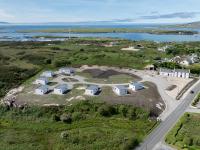 an aerial view of an island with houses and a road at Coastal Escape in Burtonport