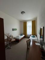 Postel nebo postele na pokoji v ubytování Pivovarský Hotel