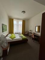 Postel nebo postele na pokoji v ubytování Pivovarský Hotel