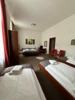 Postel nebo postele na pokoji v ubytování Pivovarský Hotel