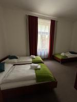 Postel nebo postele na pokoji v ubytování Pivovarský Hotel