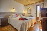 Postel nebo postele na pokoji v ubytování San Marsial Benasque Apart Hotel