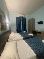 Posteľ alebo postele v izbe v ubytovaní Residence Lodi