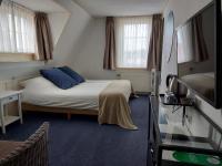 Hotel Het Gouden Boltjeにあるベッド
