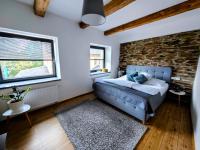 Postel nebo postele na pokoji v ubytování APARTMÁNY 91 Boží Dar