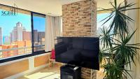 Televízia a/alebo spoločenská miestnosť v ubytovaní Precioso apartamento con vistas al mar