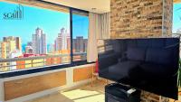 Televízia a/alebo spoločenská miestnosť v ubytovaní Precioso apartamento con vistas al mar