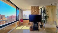 Televízia a/alebo spoločenská miestnosť v ubytovaní Precioso apartamento con vistas al mar