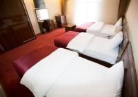 Postel nebo postele na pokoji v ubytování Resmina Hotel