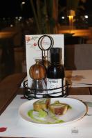 un plato de comida en una mesa con un sándwich en Azar Luxury Suites, en Vlorë