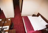 Postel nebo postele na pokoji v ubytování Resmina Hotel