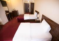 Postel nebo postele na pokoji v ubytování Resmina Hotel