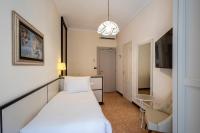 A bed or beds in a room at B&B HOTEL Diano Marina Palace