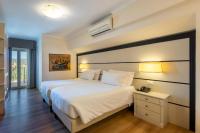 A bed or beds in a room at B&B HOTEL Diano Marina Palace