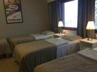 Postel nebo postele na pokoji v ubytování Guesthouse Borealis Apartments