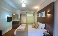 Postel nebo postele na pokoji v ubytování Amorgos Boutique Hotel