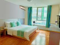 M Hotel Xiamen Haicang Maqing Road Metro Stationにあるベッド