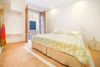 Łóżko lub łóżka w pokoju w obiekcie Petit Biniaraix - Ex Menditzu Rooms