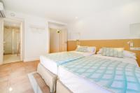 Łóżko lub łóżka w pokoju w obiekcie Petit Biniaraix - Ex Menditzu Rooms