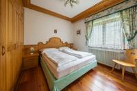 Łóżko lub łóżka w pokoju w obiekcie Casa Piva Dolomiti