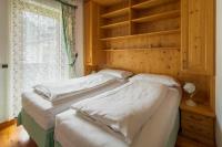 Łóżko lub łóżka w pokoju w obiekcie Casa Piva Dolomiti