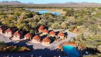 an aerial view of a resort with a river and trees at Crocodile Pools Resort in Gaborone