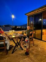 two people sitting at a table on a patio at Muse Cappadocia in Uchisar